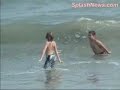 here are some new bikini candids of lindsay lohan on the 4th of july. in some of the pictures she looks like she has a bit of a belly -- and it looks like she's enjoying a nice water cocktail. either way, i bet she's way more fun drunk and fat.