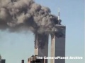 Rooftop view of both towers burning. Shot of people...