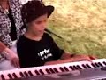 blind child playing piano and singing listen to your heart