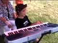 blind child playing piano and singing listen to your heart