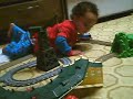 Kawika playing with his Thomas set
