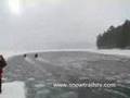 SnowtrailsTV watches water crossing sleds in Ontiaro