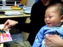 Baby Walcott laughing at the paper like crazy!