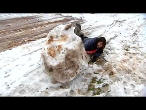 Watch reporter go face-first into giant snowman