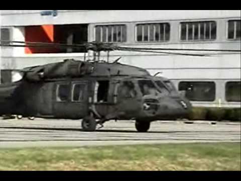UH 60 - Two UH-60 Black Hawks , two SH-60 Sea Hawks , and a CH-47 Chinook startup and takeoff from a parking lot at Raytheon in El Segundo , Ca. The Event was the JR...