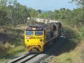 Townsville to Phosphate Hill unit sulphuric acid train 9T90 climbs Mundic bank between Homestead and Pentland on Monday 1 October 2007 with Goninan-GE CM30-8 locomotives 2823+2844 and 52 OSZYB and OSZY wagons. This train usually weighs around 4,160 tonnes