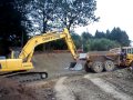 Komatsu 210 Towing damaged vovlo a25