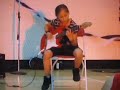 Awesome Little girl playing fallen leaves on electric guitar