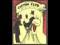 in december 1927 duke ellington's band opened in harlem the  cotton club. they stayed there until 1932, when their level of success permitted then to tour europe. by 1927, duke became involved with band agent irving mills, who signed ellington to a contract that gave mills 50% of ellington's earnings and 55% of any song royalties due to ellington's compositions. it was mills who managed to get ellington booked into the cotton club, and where his music first became known as 