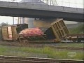 Load of pipe shifts and dumps on track