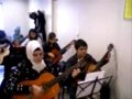 Guitar players 4th week their first piece ( Classroom 1)