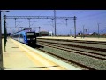 The blue Desiro EMU departs from Kiato station