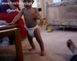 Baby gets down to the groove in nothing but diaper