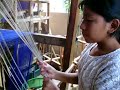 Rosa Marina Mux and her daughter weaving on a foot loom