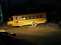 Jumping school bus w/deer head flying