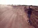 kyle-mountain-boarding-down-a-dirt-trail-in-moab.html