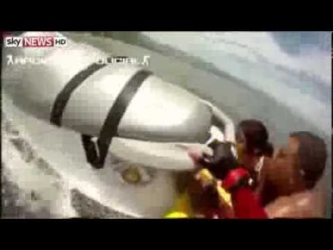family - A firefighter in Brazil has rescued a drowning family of five, on his jet ski. Marcelo dos Santos recorded his impressive feat at White Beach, Bertioga. SUBS...