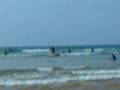 kid falls of surf board