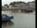 Oil containment boom deployment