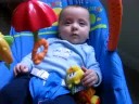 Chase playing in his bouncy chair