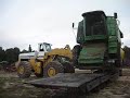 Unloading A 12.5 Ton 9610 John Deere Combine with Hough 560