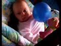 Zoe playing with balloon 3 months