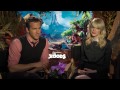 deidre behar interviews emma stone, ryan reynolds, and nicolas cage about the croods! talking cavemen, past characters fitting in with the croods, and what's...