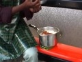 Agya Koo offers to share his Food with a Man at Bus Stop