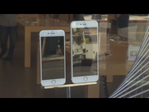 black market - Shoppers with Chinese passports and wads of cash line up outside an Apple store in California.