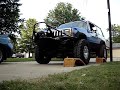 XJ driving over vehicle ramps