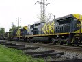 May 8, 2008: NS 098 takes 10 MRS C38EMI locomotives to Penn Terminal to be shipped to Brazil. NS 9507 leads MRS C38EMI 3956-2, MRS C38EMI 3959-7, MRS C38EMI 3963-5, MRS C38EMI 3962-7, MRS C38EMI 3965-1, MRS C38EMI 3964-3, MRS C38EMI 3960-1, MRS C38EMI 3957-1, MRS C38EMI 3958-9, MRS C38EMI 3961-9. MRS (Malha Ferrovia da Regiao Sudeste) Logística SA uses a 5 foot 3 inch gauge railroad, and the trucks on the locomotives are temporary. NS 098 passes a gang installing ties, as you can see, nice ...