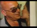 Telly Savalas woos Maud Adams