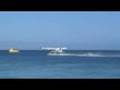 Seaplane taking off from Plantation Is. Resort