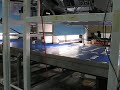 Four Flexpickers collating lids into piles