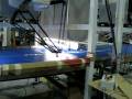 Four Flexpickers collating lids into piles