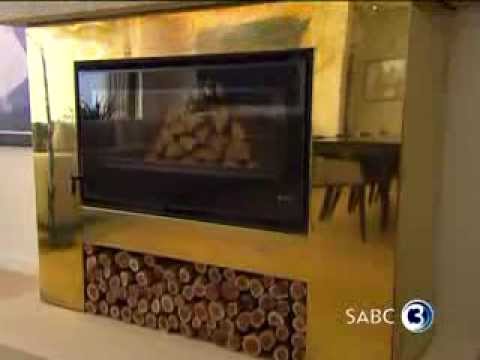 Top Billing features a home with a designer brass fire-place 