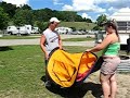 Jakob and Tarra trying to fold 2 second tent