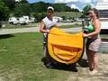 Jakob and Tarra trying to fold 2 second tent