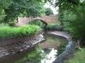Canal bursts bank into River Stour  in Staffordshire