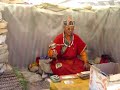 107 Tibetan monk praying on the way to Drepung Monastery