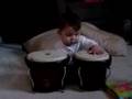 Baby tuning his drums