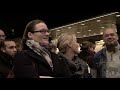 members of the dutch radio orchestra's and the radio choir staging a protest concert at the Hague central station against the dutch government plans to economize culture conducted by jules buckley please go to WWW.MCO.NL and sign the petition thanks
