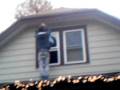 Tyler on roof imitating my stepdads walk. hehe