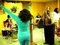 sunday night service in birmingham, alabama.  first lady quanita croom wood leading praise and worship. bishop wood on keyboard, son, sir charles on drums. daughter empress in background.  04/27/08