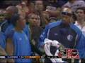 Josh Howard of the Dallas Mavericks racked by Avery Johnson