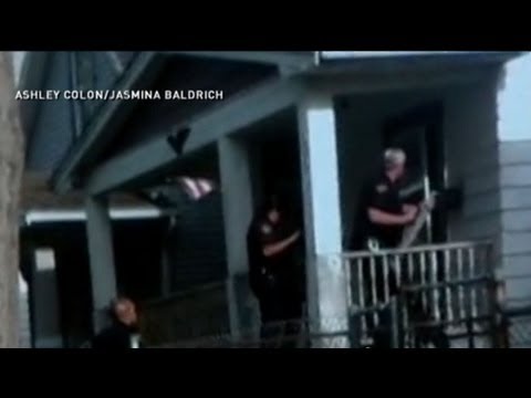 cleveland - First glimpse of freedom caught on cell phone video as Cleveland police pry open captive's door.