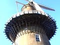 views around the town of leiden, including the streets, canals and  windmills.