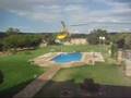 Helicopter borrows water from swimming pool - fire, firefighters, helicopter, pool, water