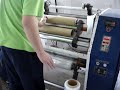 Stretch film rewinder slitter