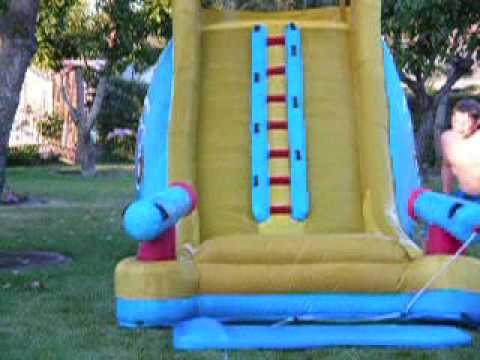 Charlette falling down slide